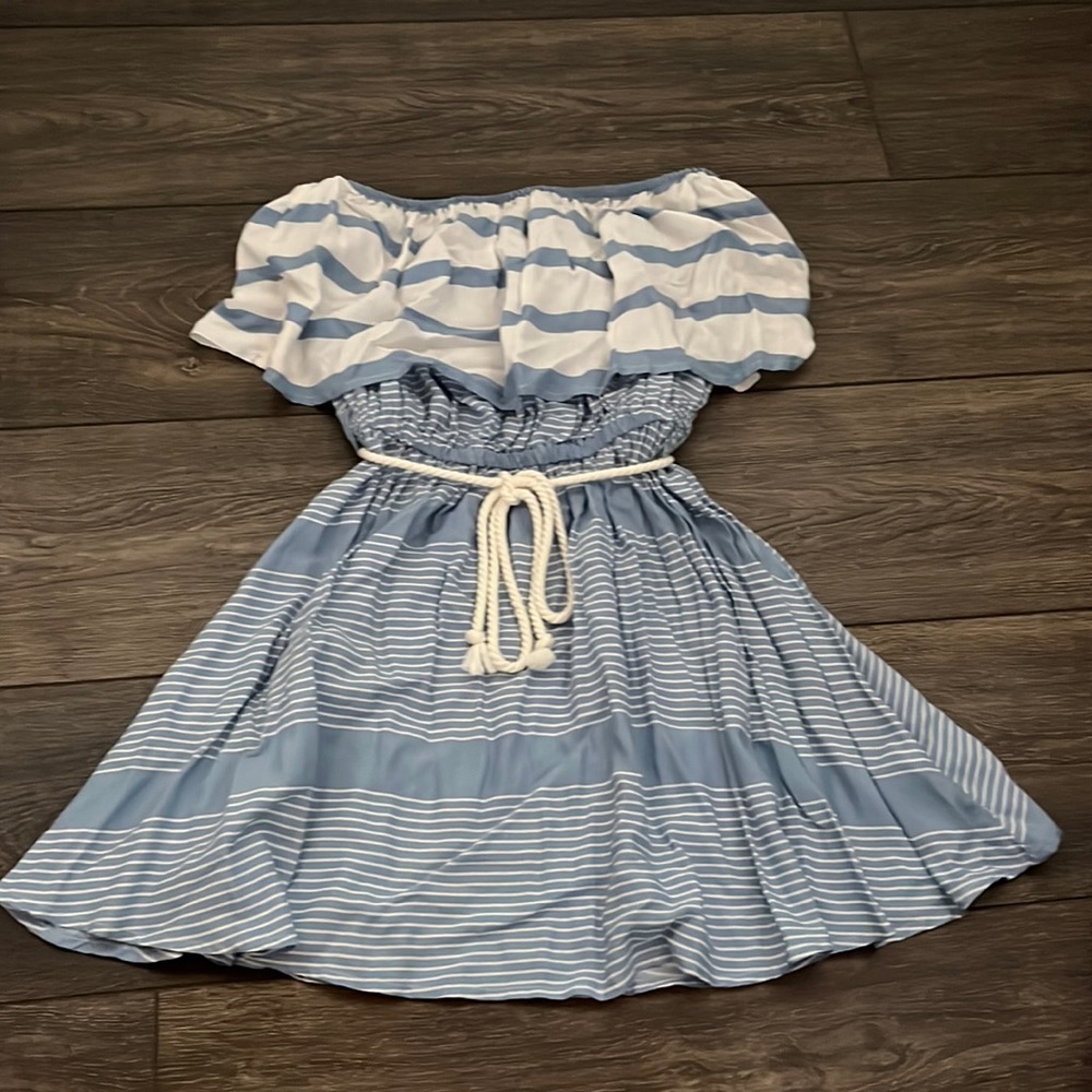 This dress is a cute strapless beach dress that has never been worn.